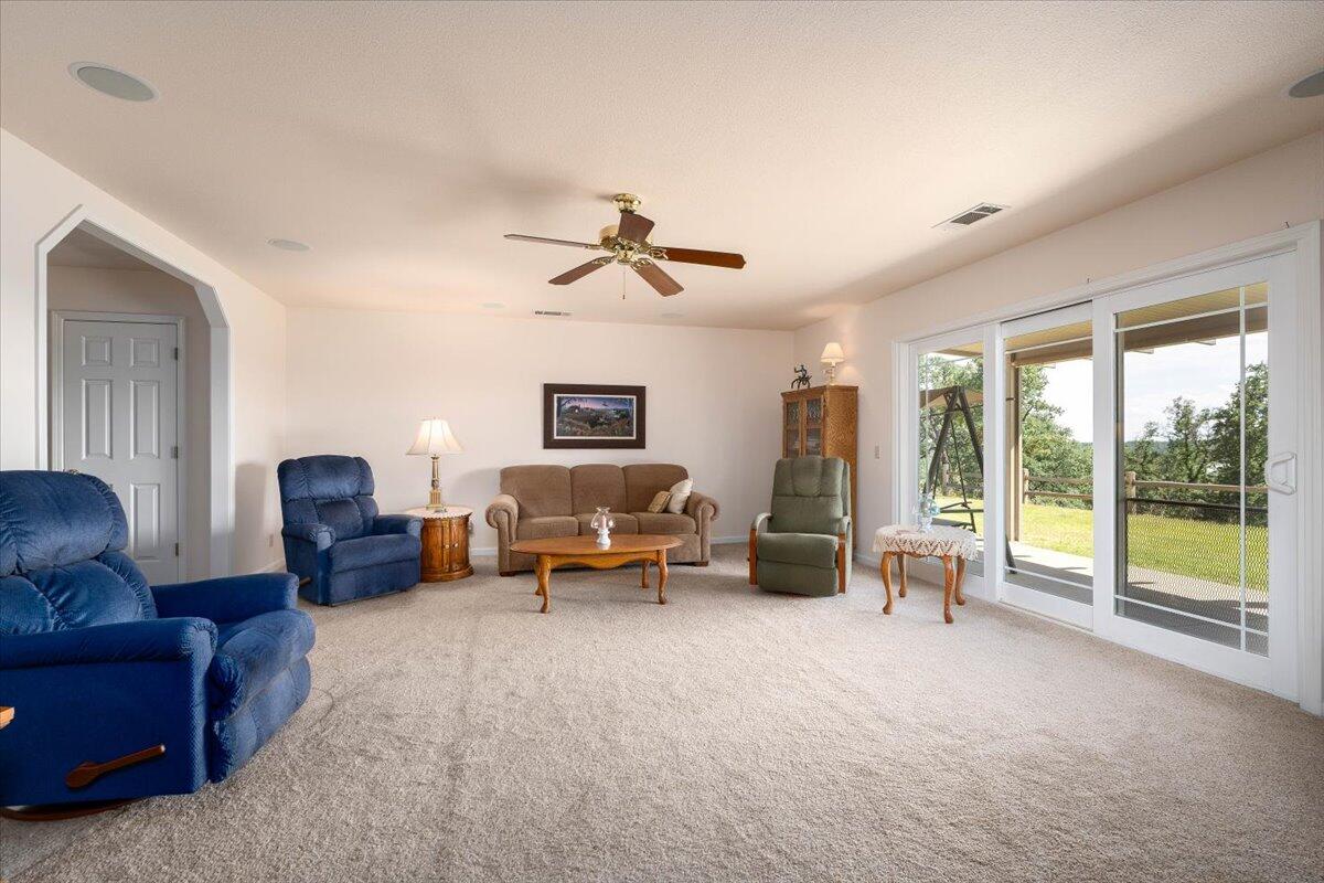 19035 Bonita Road Red Bluff, CA 96080 - Photo 17 of 55 a living room with furniture and a large window