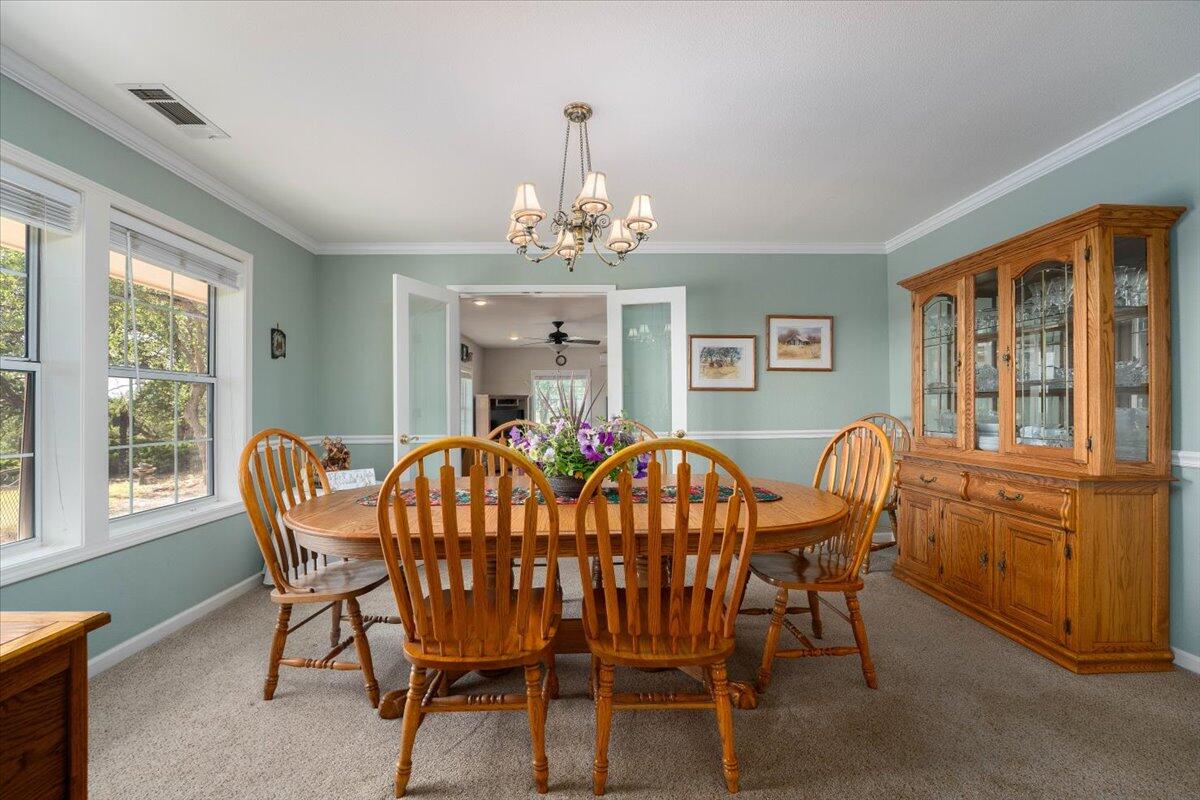 19035 Bonita Road Red Bluff, CA 96080 - Photo 19 of 55 a view of a dining room with furniture window and outside view