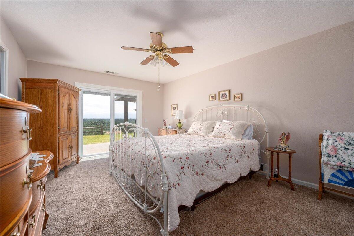 19035 Bonita Road Red Bluff, CA 96080 - Photo 22 of 55 a bed room with a bed and a window