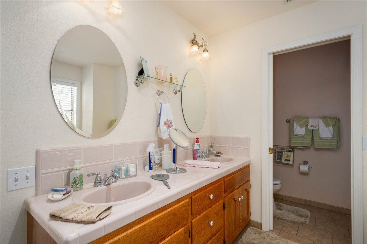 19035 Bonita Road Red Bluff, CA 96080 - Photo 26 of 55 a bathroom with a sink and a mirror