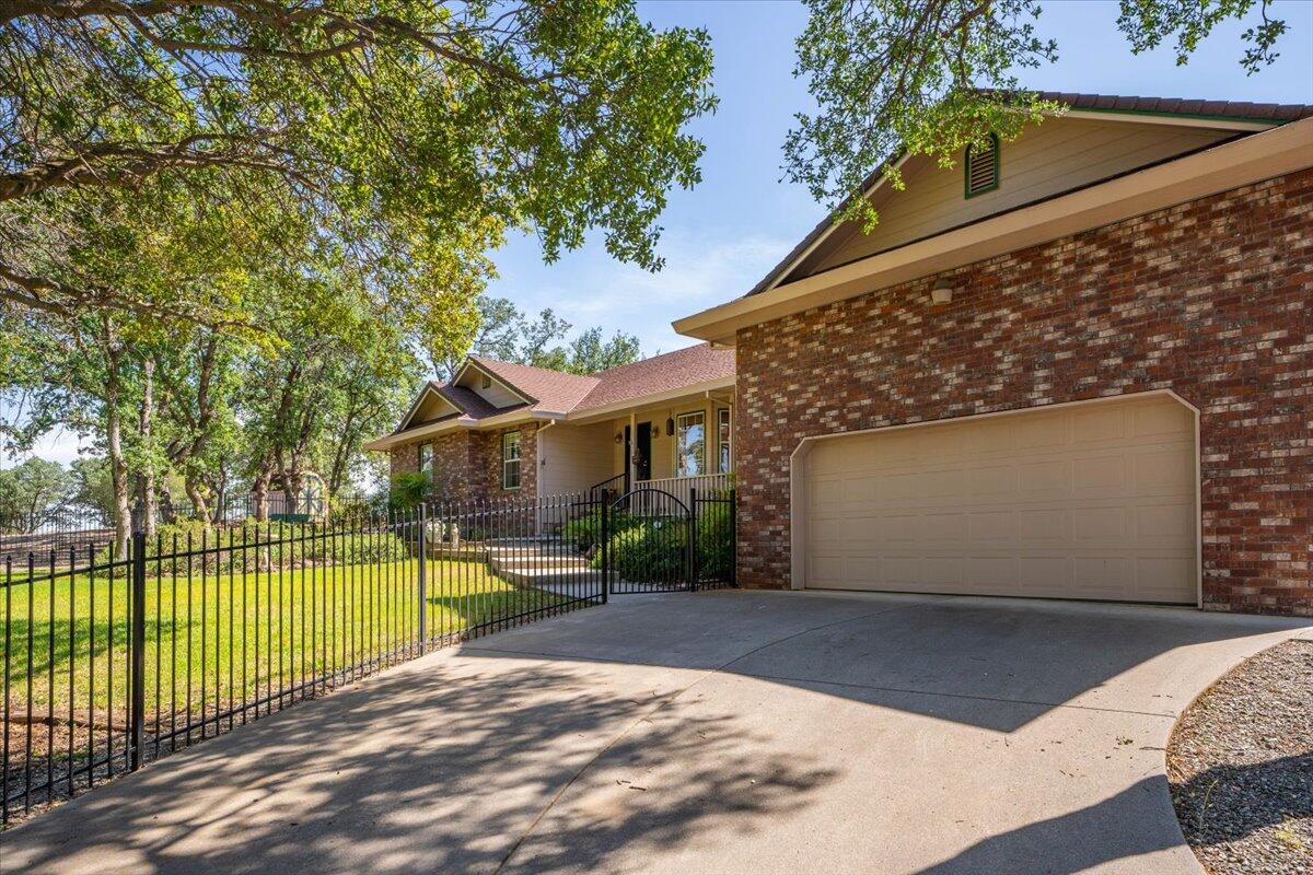 19035 Bonita Road Red Bluff, CA 96080 - Photo 3 of 55 a view of a backyard with a garden