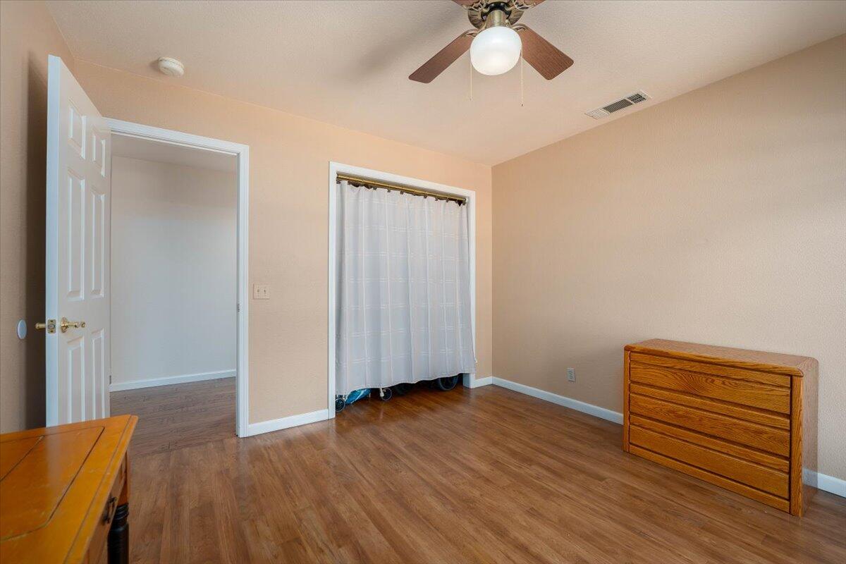19035 Bonita Road Red Bluff, CA 96080 - Photo 32 of 55 a view of room with wooden floor and ceiling fan