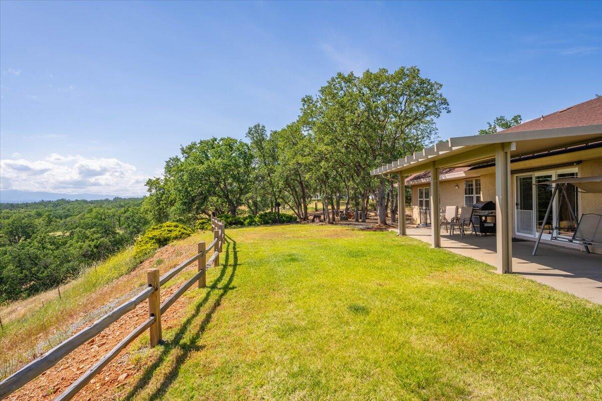 19035 Bonita Road Red Bluff, CA 96080 - Photo 39 of 55 a swimming pool with outdoor seating and yard