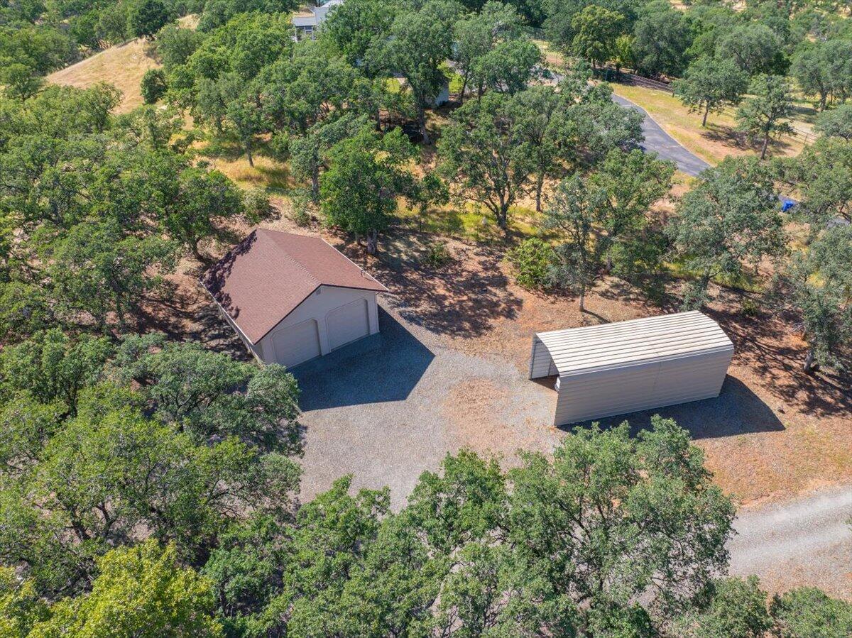 19035 Bonita Road Red Bluff, CA 96080 - Photo 48 of 55 an aerial view of a house with a yard and garden