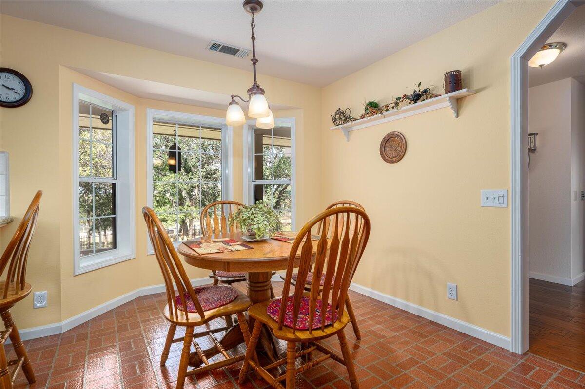 19035 Bonita Road Red Bluff, CA 96080 - Photo 9 of 55 a view of a dining room with furniture window and wooden floor
