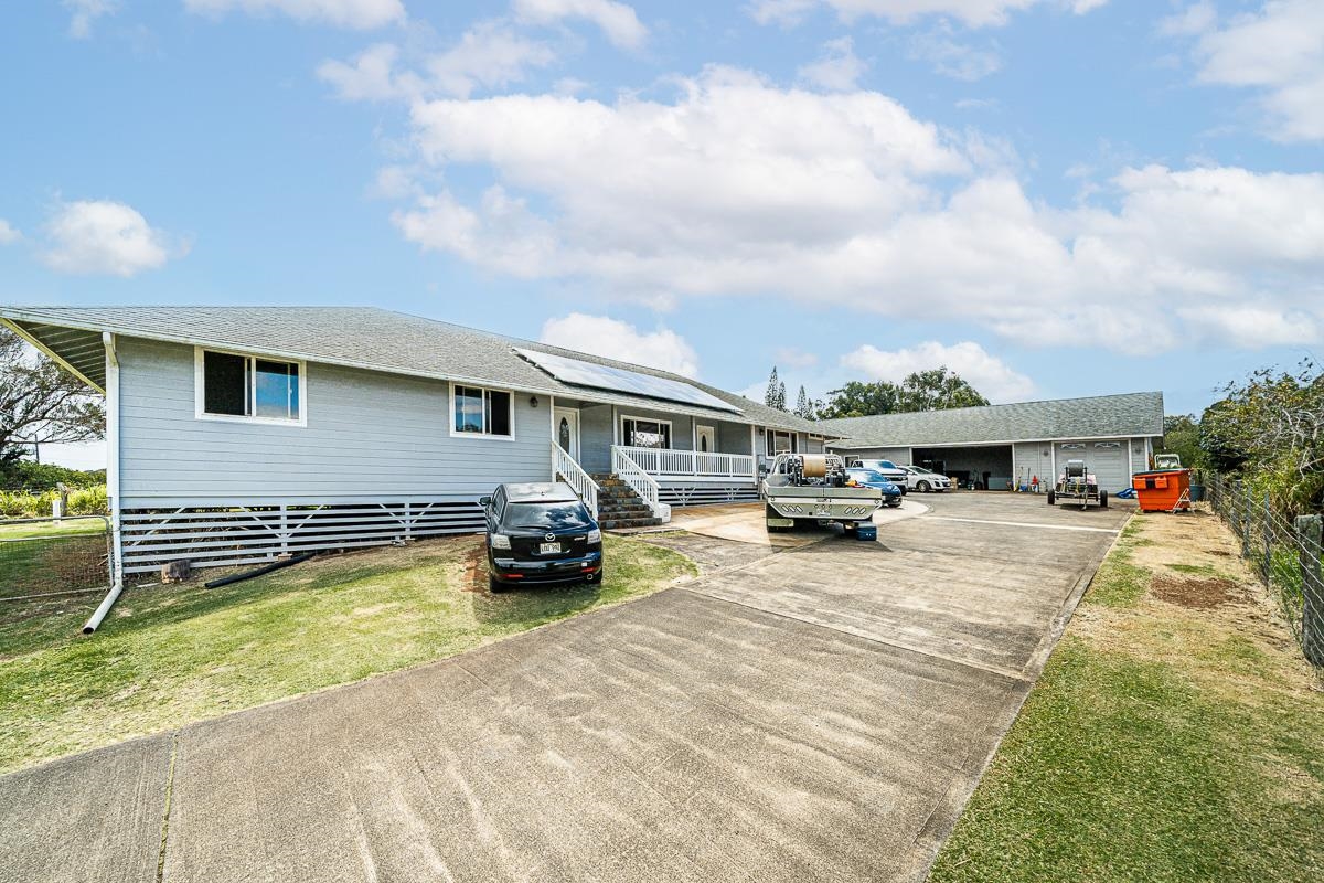 a view of a house with swimming pool and sitting area