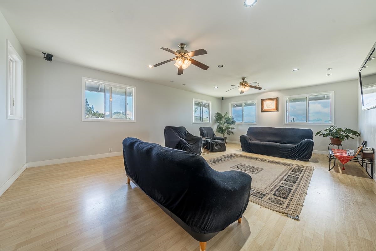2640 Puuomalei Road Haiku, HI 96708 - Photo 14 of 30 a living room with furniture and a wooden floor