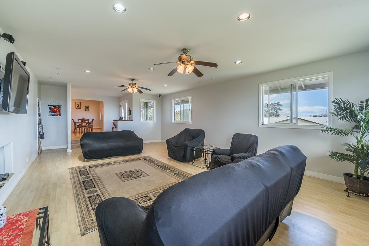 2640 Puuomalei Road Haiku, HI 96708 - Photo 16 of 30 a living room with furniture a flat screen tv and potted plant