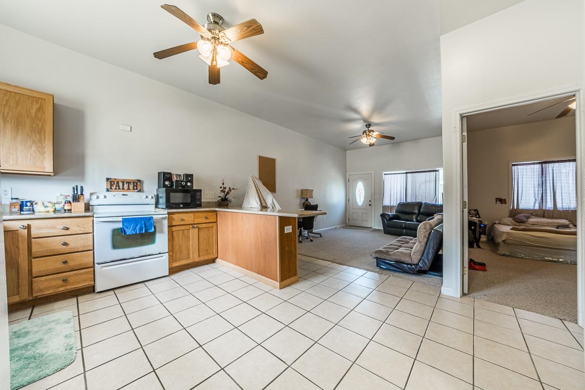 2640 Puuomalei Road Haiku, HI 96708 - Photo 25 of 30 a kitchen with cabinets and chairs