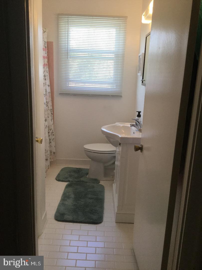 4391 Crest Heights Road Baltimore, MD 21215 - Photo 11 of 14 Upstairs bathroom