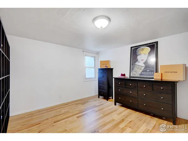 a room with a dresser and a mirror