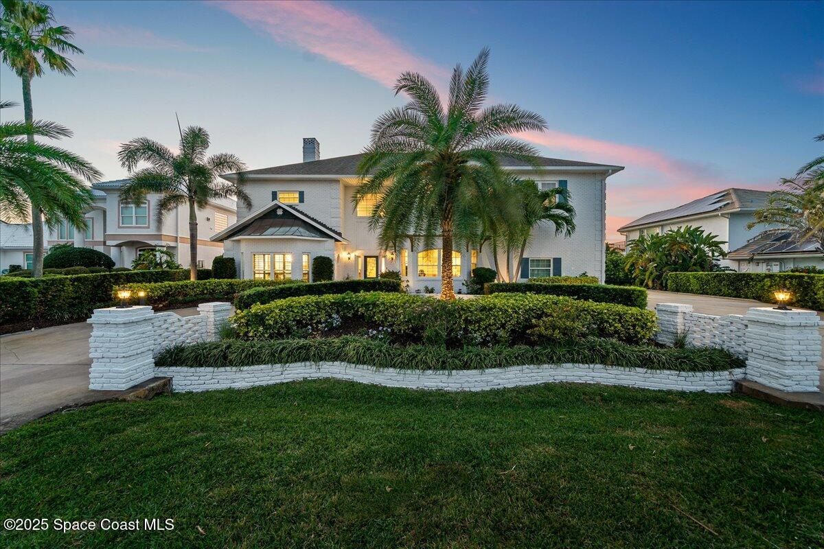 466 Lanternback Island Drive Satellite Beach, FL 32937 - Photo 1 of 117 a front view of house with yard and green space