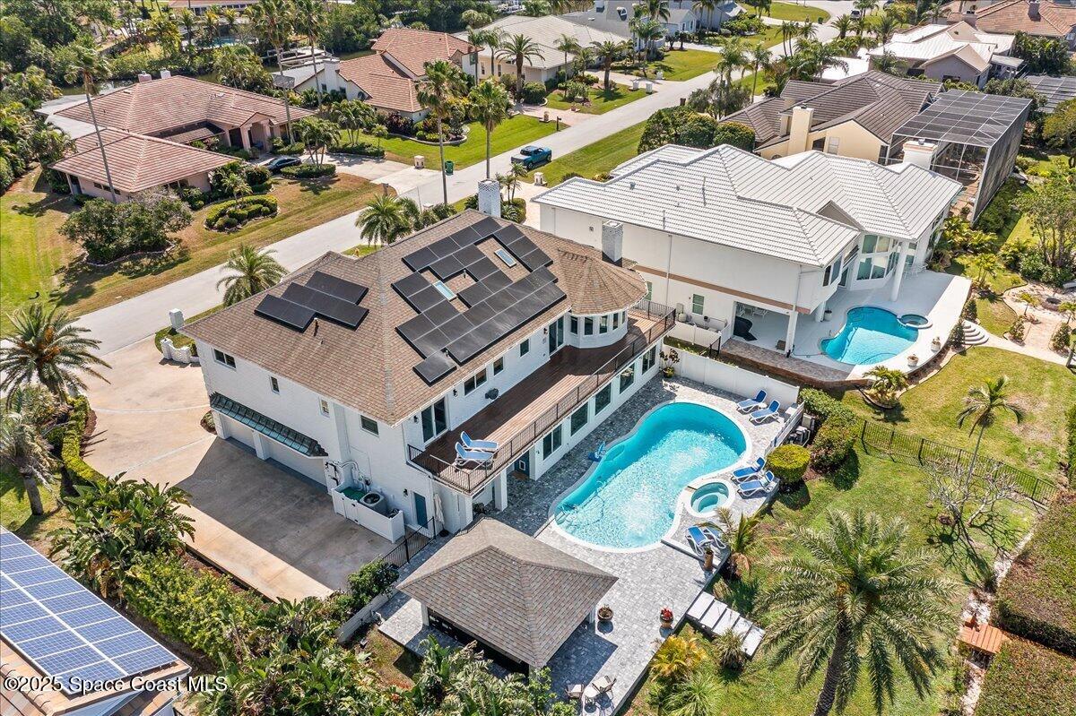 466 Lanternback Island Drive Satellite Beach, FL 32937 - Photo 111 of 117 an aerial view of a house with a yard and outdoor seating