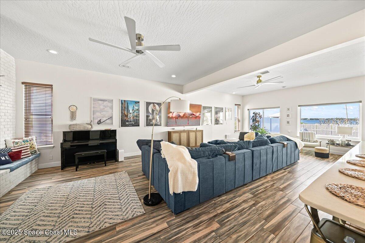 466 Lanternback Island Drive Satellite Beach, FL 32937 - Photo 16 of 117 a living room with lots of furniture and wooden floor