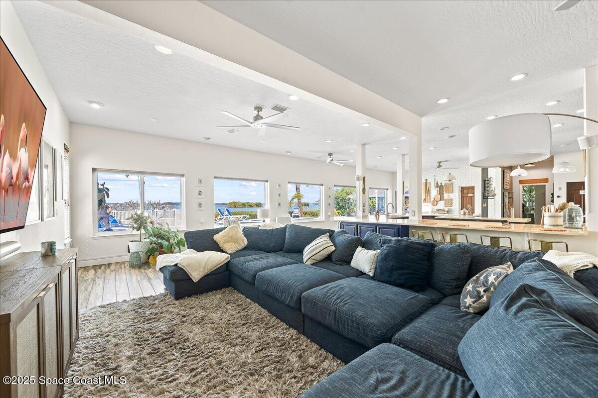 466 Lanternback Island Drive Satellite Beach, FL 32937 - Photo 17 of 117 a living room with furniture and a large window