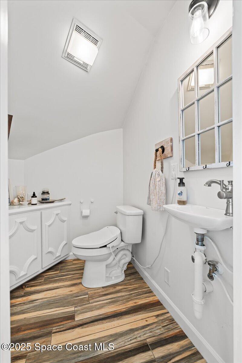 466 Lanternback Island Drive Satellite Beach, FL 32937 - Photo 22 of 117 a bathroom with a sink toilet a mirror and shower