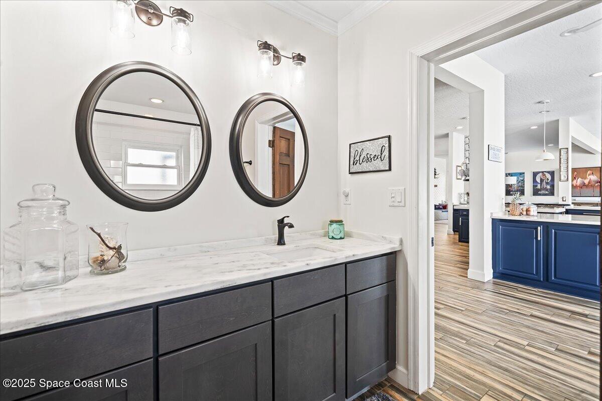 466 Lanternback Island Drive Satellite Beach, FL 32937 - Photo 28 of 117 a bathroom with a double vanity sink and a mirror