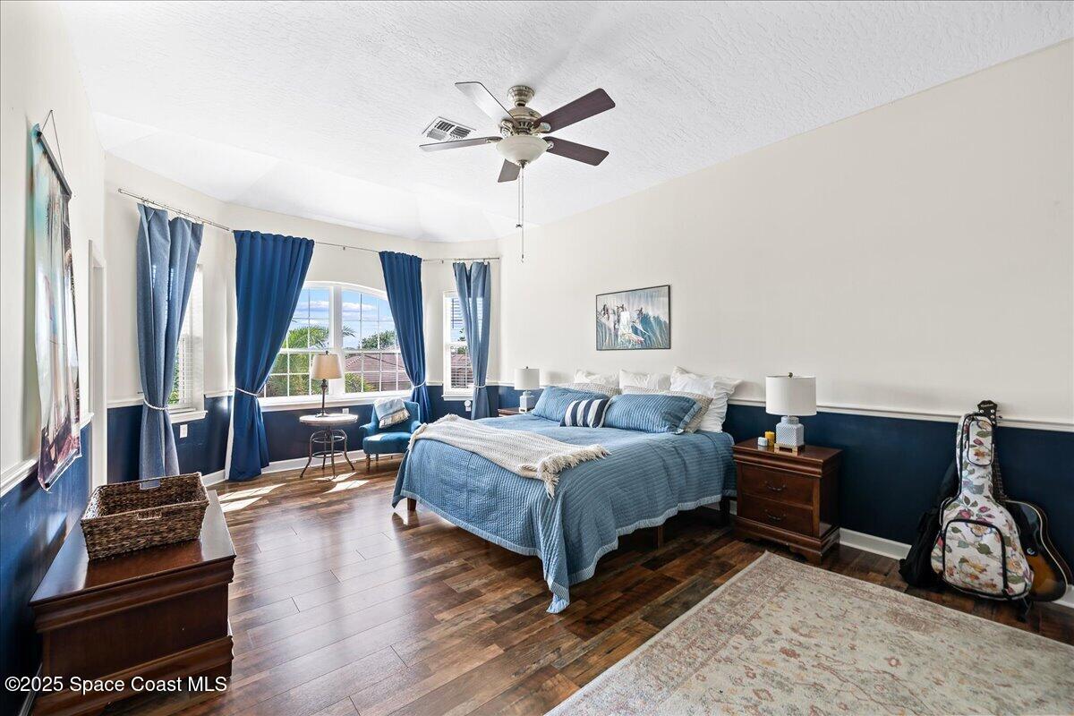 466 Lanternback Island Drive Satellite Beach, FL 32937 - Photo 46 of 117 a bedroom with a bed and a couch