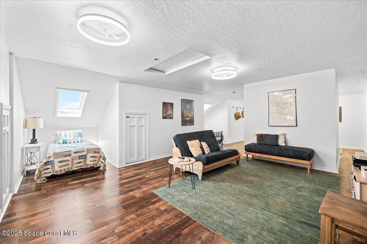 466 Lanternback Island Drive Satellite Beach, FL 32937 - Photo 59 of 117 a living room with furniture and a wooden floor