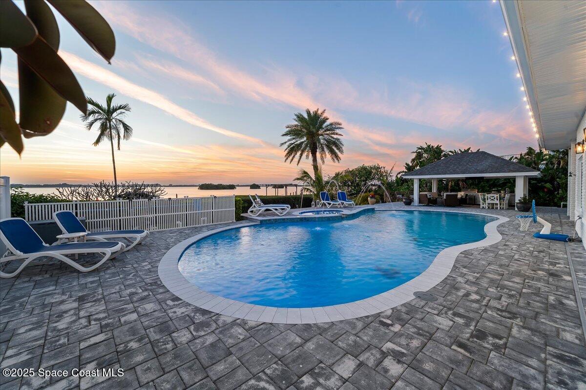 466 Lanternback Island Drive Satellite Beach, FL 32937 - Photo 77 of 117 swimming view of a swimming pool with a lounge chair