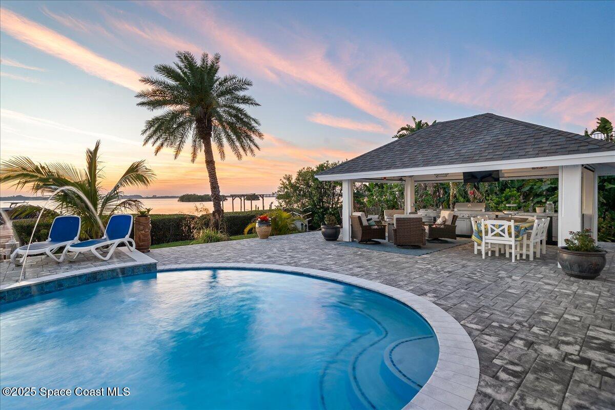 466 Lanternback Island Drive Satellite Beach, FL 32937 - Photo 79 of 117 a swimming pool with outdoor seating yard and barbeque oven