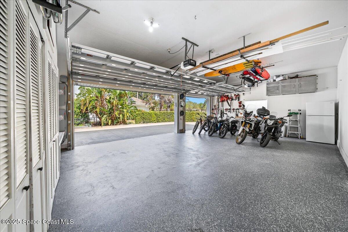 466 Lanternback Island Drive Satellite Beach, FL 32937 - Photo 96 of 117 a view of a hallway with a table and chairs