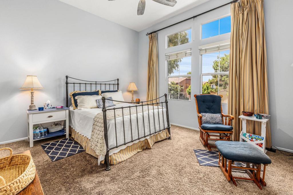 625 Sumner Way, Unit 2 Oceanside, CA 92058 - Photo 18 of 31 a bed room with a bed and a chair