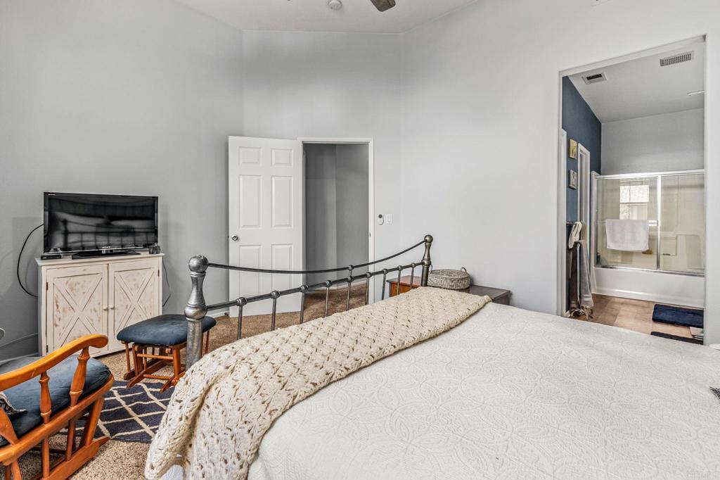 625 Sumner Way, Unit 2 Oceanside, CA 92058 - Photo 19 of 31 a bedroom with a bed and dresser