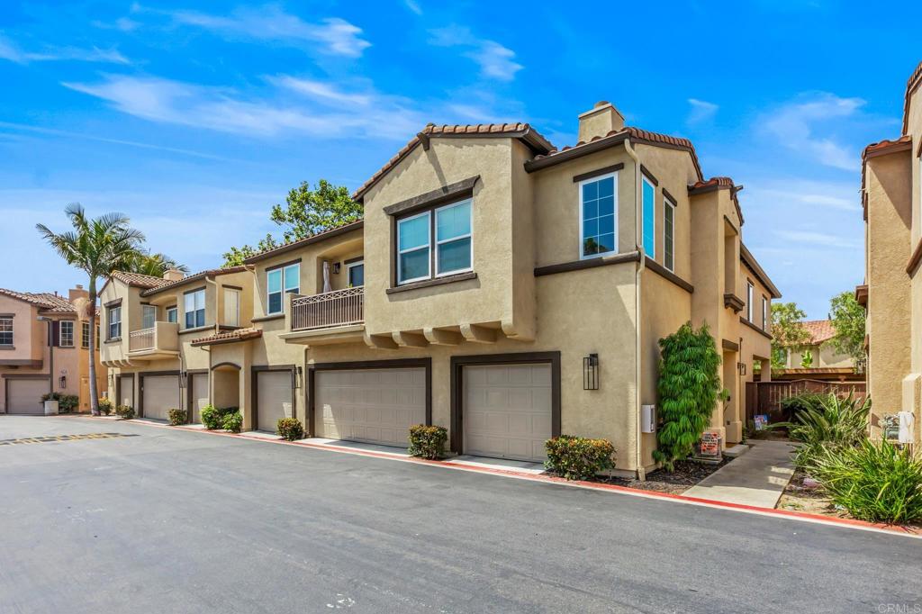 625 Sumner Way, Unit 2 Oceanside, CA 92058 - Photo 2 of 31 a front view of a house with a yard