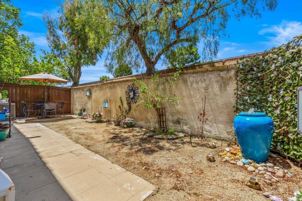 625 Sumner Way, Unit 2 Oceanside, CA 92058 - Photo 23 of 31 a view of a backyard with plants and a patio