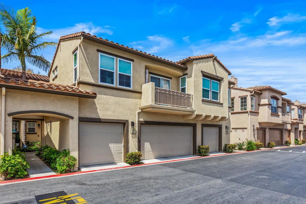 625 Sumner Way, Unit 2 Oceanside, CA 92058 - Photo 27 of 31 a front view of a house with a garage