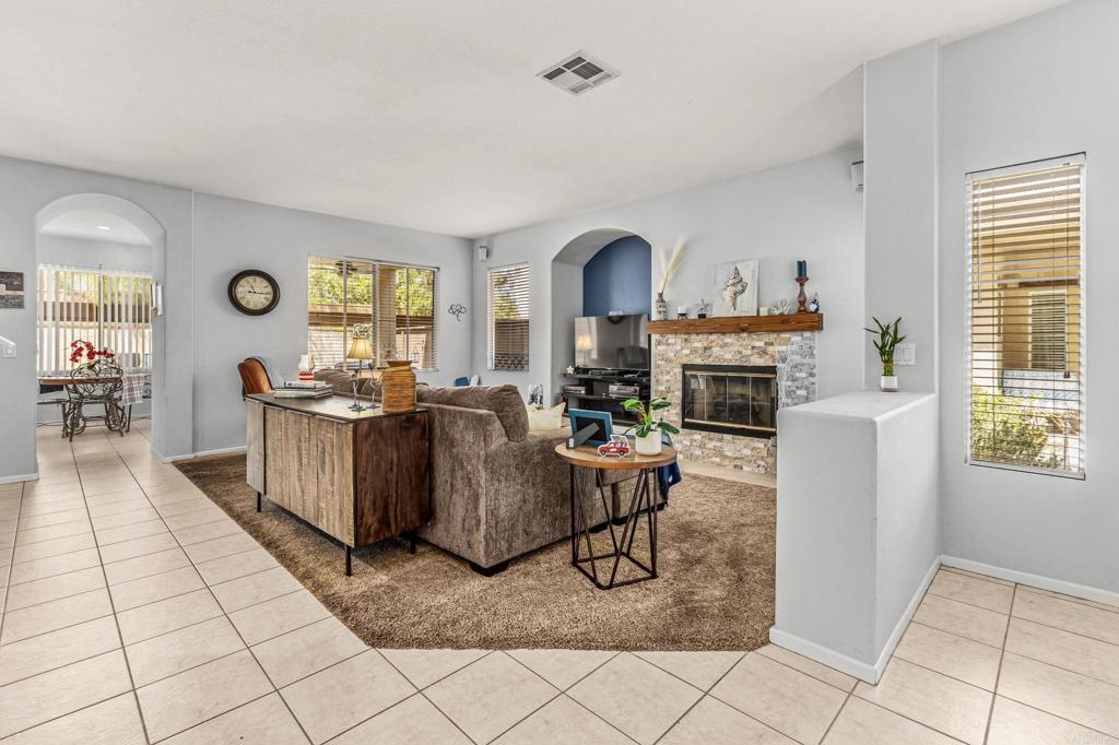 625 Sumner Way, Unit 2 Oceanside, CA 92058 - Photo 3 of 31 a living room with furniture and a fireplace