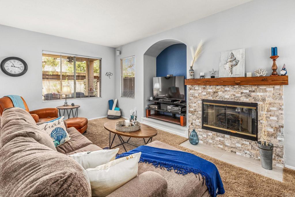 625 Sumner Way, Unit 2 Oceanside, CA 92058 - Photo 4 of 31 a living room with furniture and a fireplace