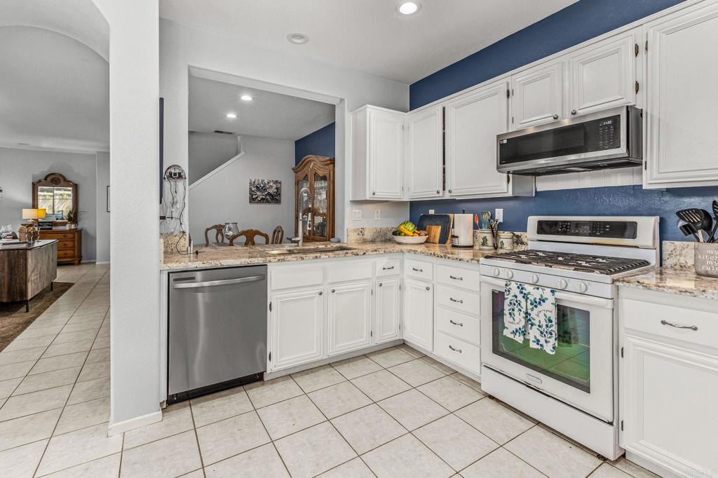 625 Sumner Way, Unit 2 Oceanside, CA 92058 - Photo 10 of 31 a kitchen with cabinets appliances and a counter top space