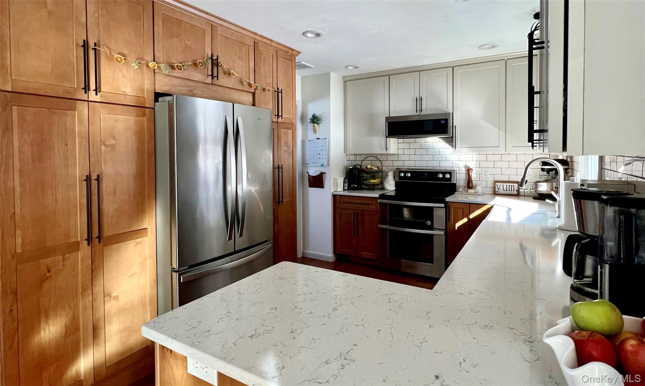 2 Garden Place Beacon, NY 12508 - Photo 16 of 33 a kitchen with stainless steel appliances granite countertop a refrigerator a stove and a sink with wooden floor