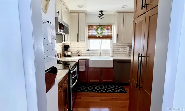a bathroom with a sink a mirror and shower