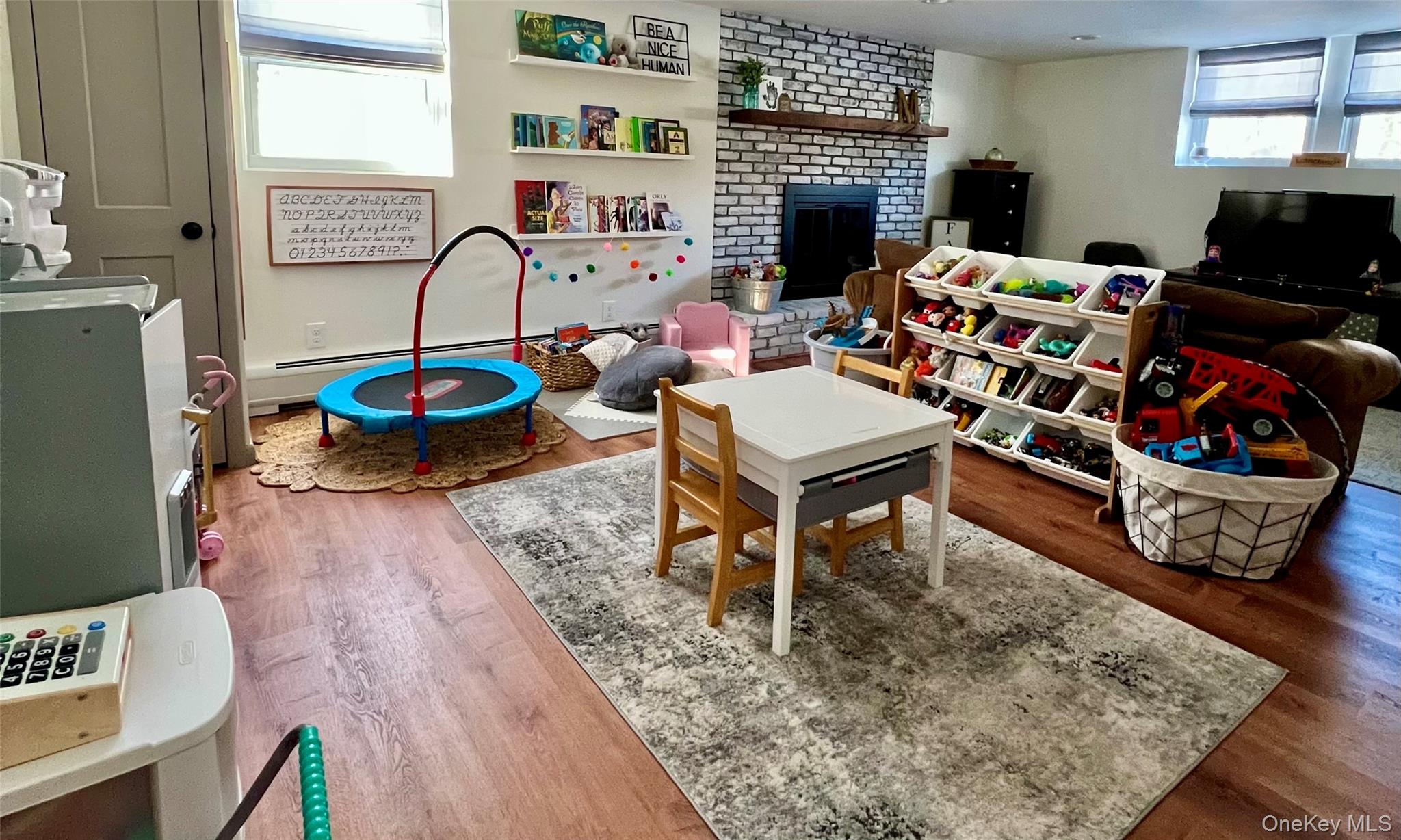 2 Garden Place Beacon, NY 12508 - Photo 30 of 33 a living room with furniture a rug and a fireplace