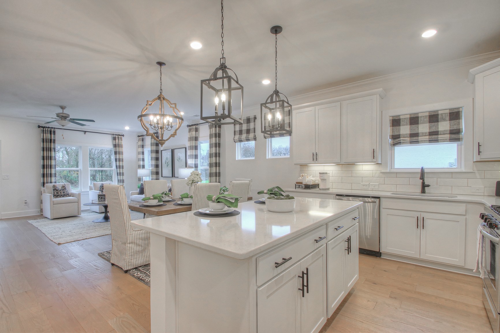 3121 Arbor Valley Rd Spring Hill Spring Hill, TN 37174 - Photo 8 of 19 a kitchen with center island white cabinets and stainless steel appliances