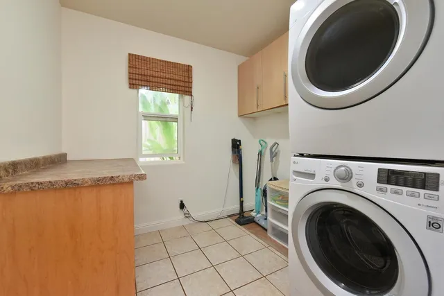 a view of a storage & utility room with a washer dryer
