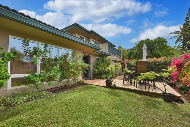 a view of an chairs and table in the garden