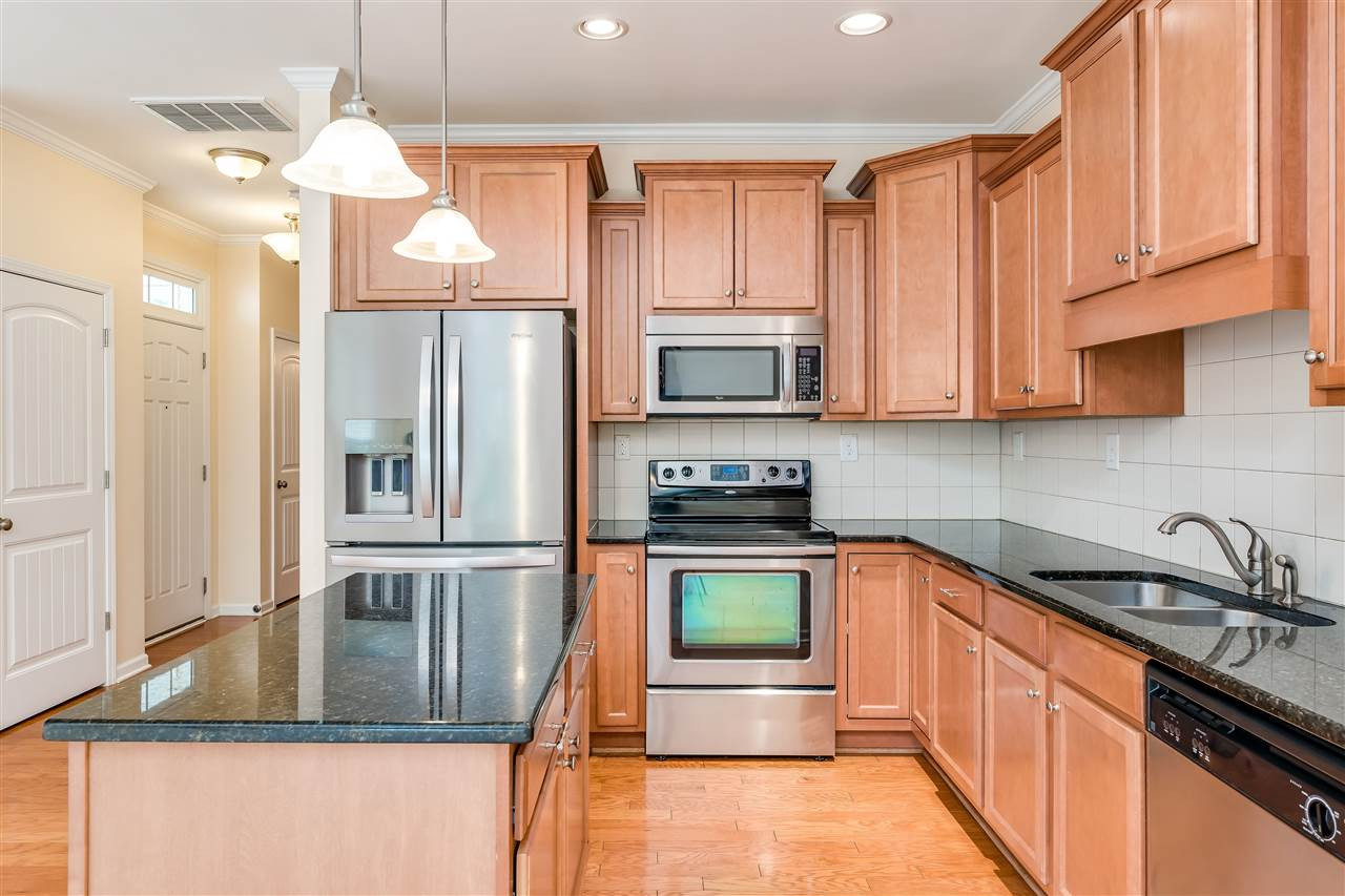 2443 Memory Ridge Drive Raleigh, NC 27606 - Photo 5 of 28 Granite counters with center island and custom light fixtures. Kitchen
