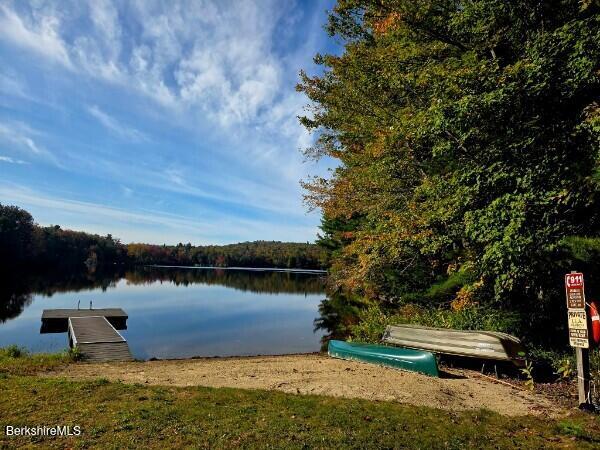 0 Moberg Road Becket, MA 01223 - Photo 2 of 9 a view of a lake with houses in the back