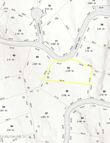 a bathroom with a bathtub and mirror