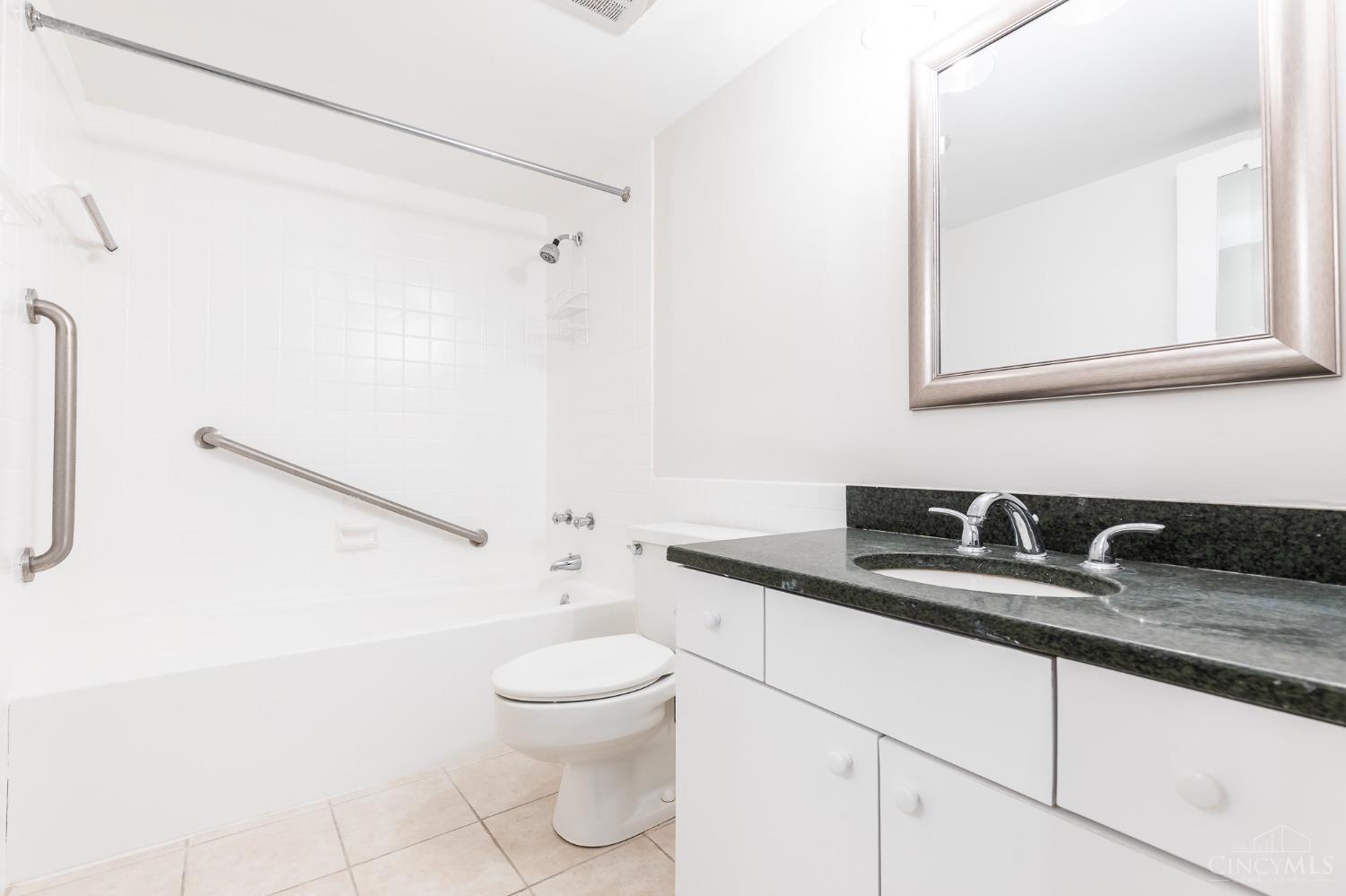2444 Madison Road, Unit 811 Cincinnati, OH 45208 - Photo 6 of 33 Bathroom with solid surface counters, new lighting and mirror.