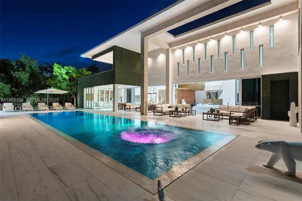 a view of swimming pool with outdoor seating