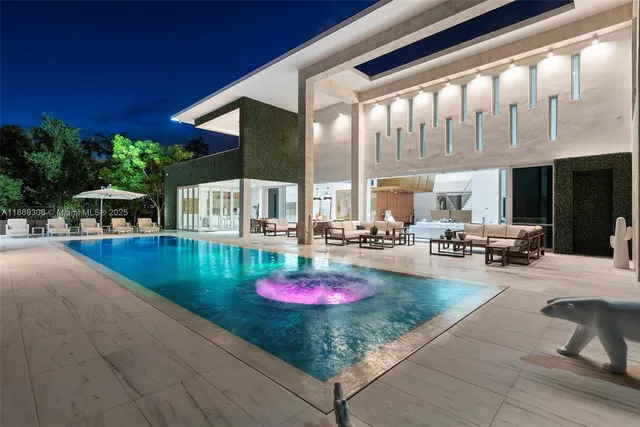 a view of swimming pool with outdoor seating