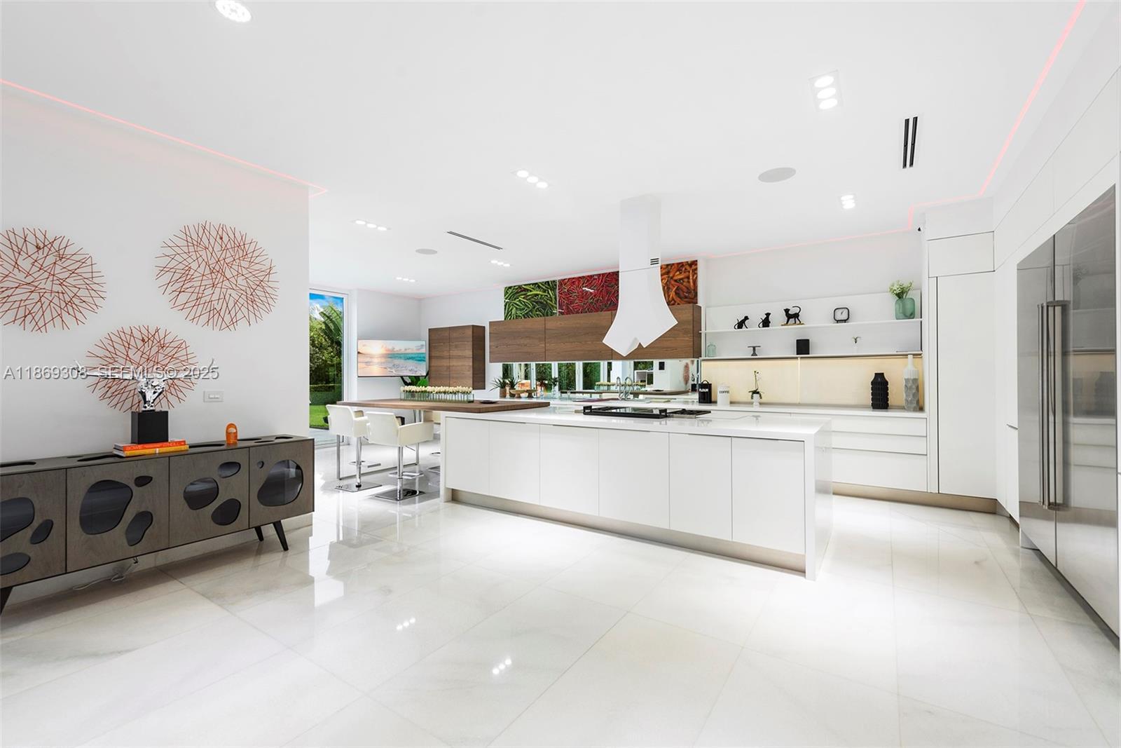 7450 Southwest 102nd Street Pinecrest, FL 33156 - Photo 12 of 51 a large white kitchen with stainless steel appliances