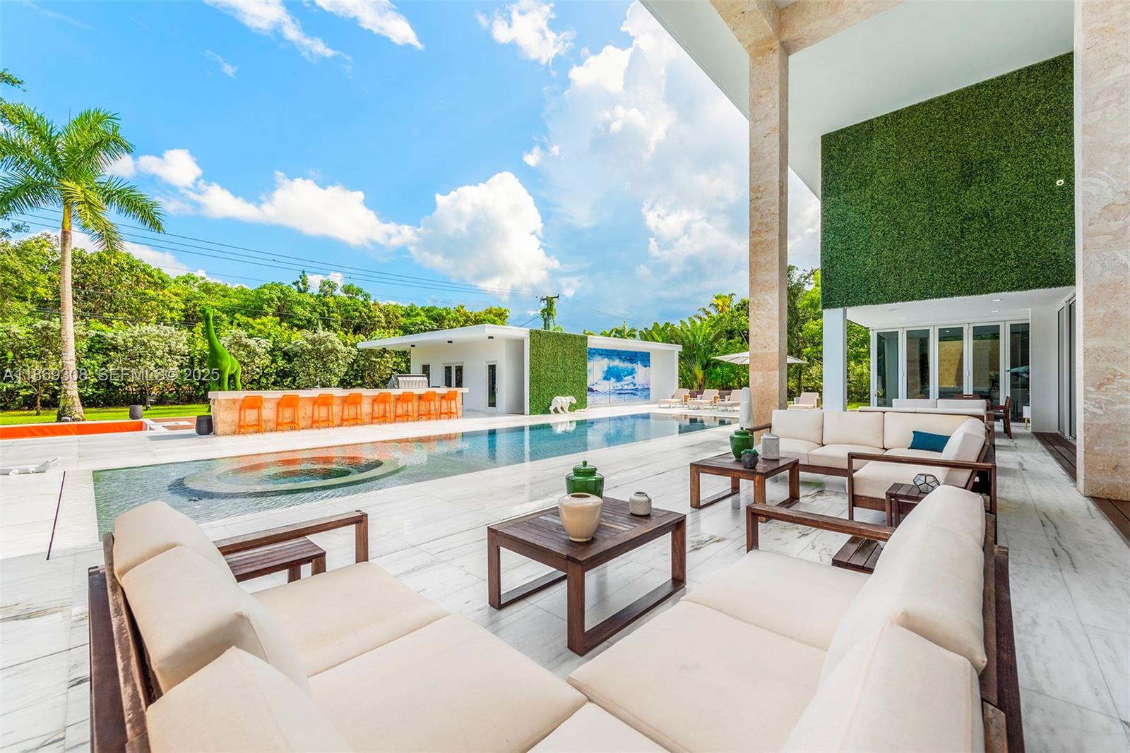 7450 Southwest 102nd Street Pinecrest, FL 33156 - Photo 16 of 51 a outdoor living space with furniture and garden view