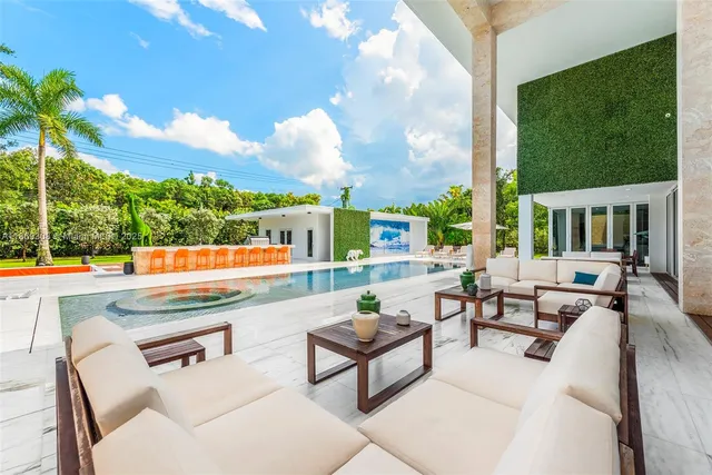 a view of a house with backyard porch and patio