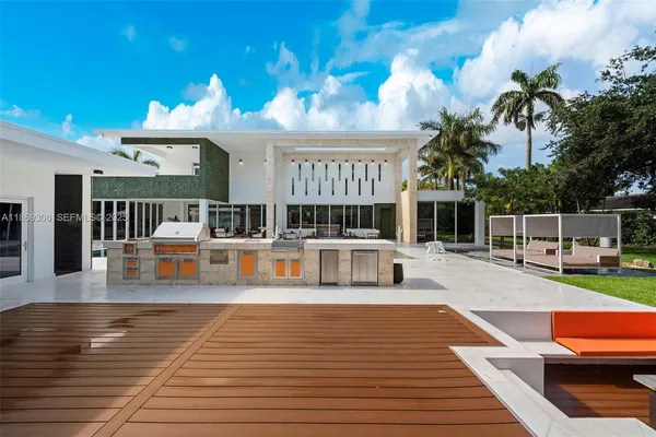 a view of a swimming pool with seating space